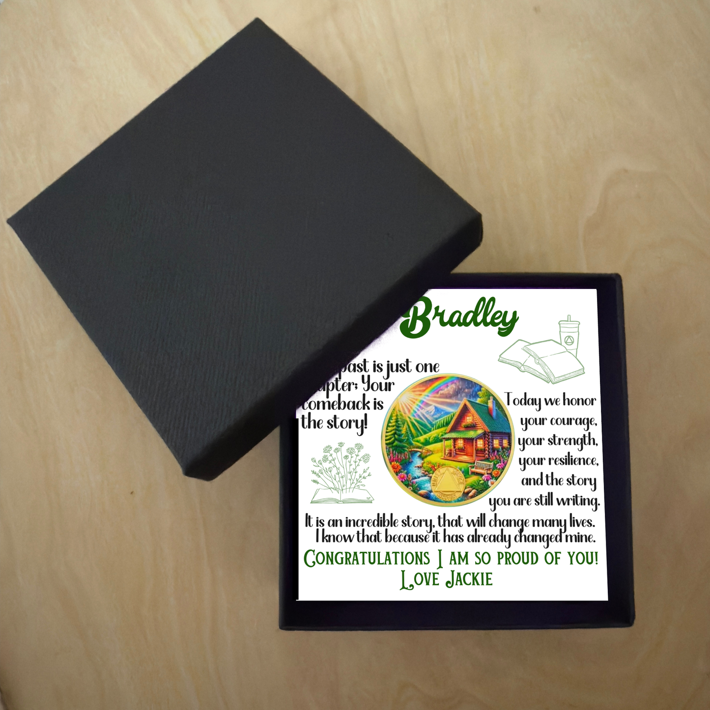 Bradley gift box with card and circular sobriety milestone coin beside open lid
