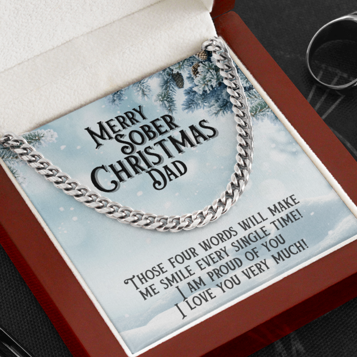 Original silver Cuban-link chain detail and fixed Christmas message card for Dad; the words are printed on the card.