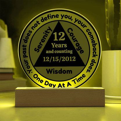 Circular LED sobriety date plaque with wooden base, illuminated; reads 12 Years Wisdom
