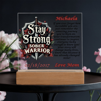 Personalized LED plaque on a wooden base with shield text and name Michaela
