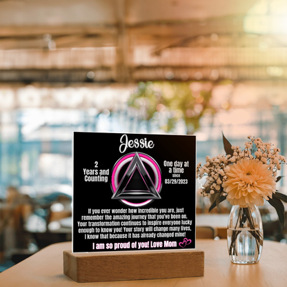 Personalized LED sobriety milestone plaque on wooden base with glowing triangle motif