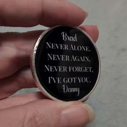 Sobriety coin with 'Brad' and quote 'Never alone...' plus 'Danny' at bottom