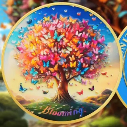 Sobriety coin close-up of colorful tree with butterflies and gold rim, side with artwork