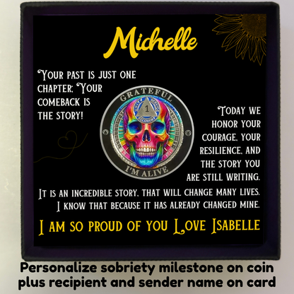 Personalized gift box with square card showing “Michelle” and rainbow skull sobriety coin