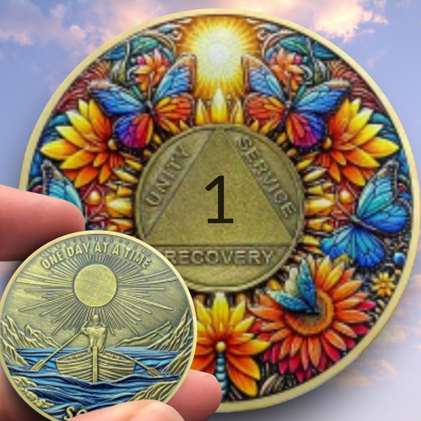 Gold-toned recovery coin with butterfly floral design and Unity Service emblem