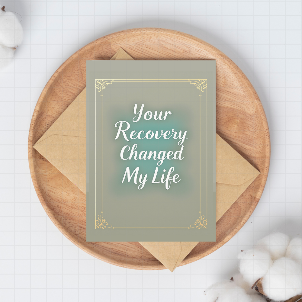 Your Recovery Changed My Life sponsor card with gold frame on kraft envelope