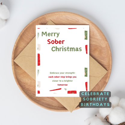 Merry Sober Christmas card on wooden tray with kraft envelope and Celebrate Sobriety badge