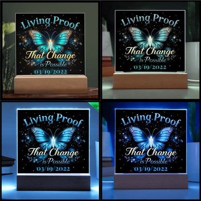 LED acrylic plaque on wood base shown in multiple light colors with butterfly design