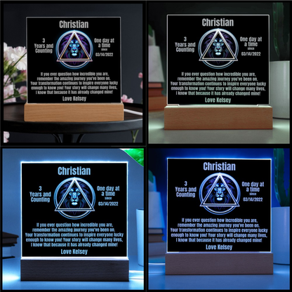 Square LED plaque on wood base with Christian triangle lion design and message