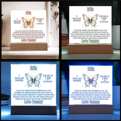 LED sobriety plaque shown in multiple glow colors on wood base, name Erin