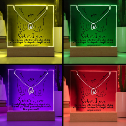 LED light base with glowing hands and heart pendant design across vibrant color themes