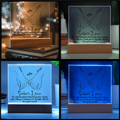 LED sobriety plaque with hands-heart design and message, blue glowing frame, wood base