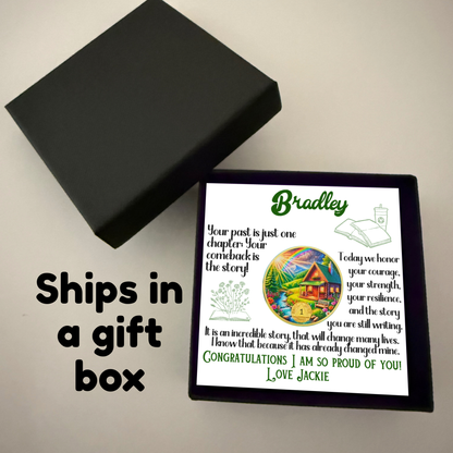 Bradley gift box with card and circular sobriety milestone coin with house scene