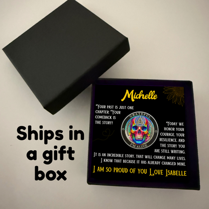 Black gift box with open lid and square card featuring rainbow skull coin artwork