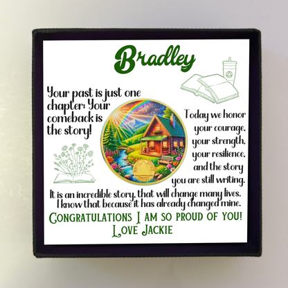 Bradley gift box with card and circular sobriety milestone coin featuring scenic house artwork