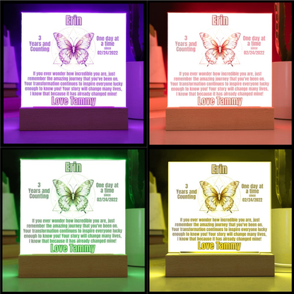 LED sobriety plaque with butterfly design on wood base in four glow colors