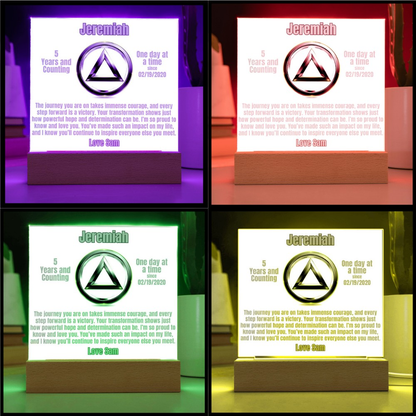 LED plaque display showing personalized plaque with circular emblem and wooden base in colors
