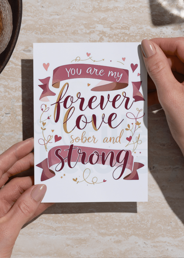 Handheld digital download card with 'You are my forever love sober and strong' text
