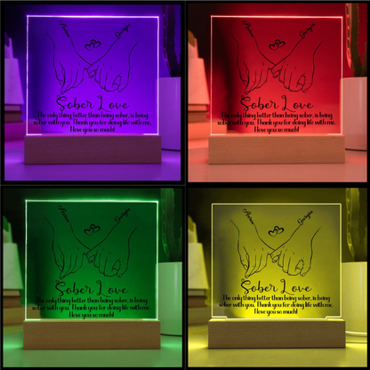 LED sobriety plaque with hands-heart design in purple, red, green, and yellow glow