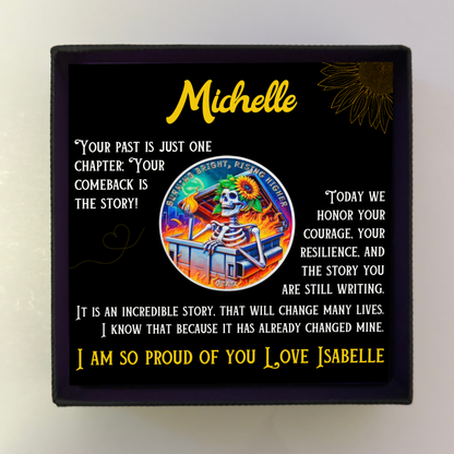 Personalized coin card inside black gift box with Michelle name and sunflower skeleton art