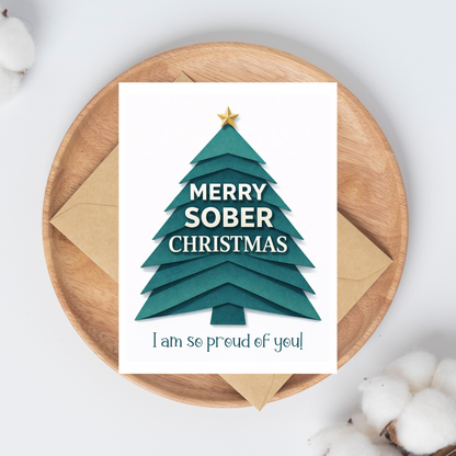 Teal Christmas greeting card with gold star tree and “MERRY SOBER CHRISTMAS” text.