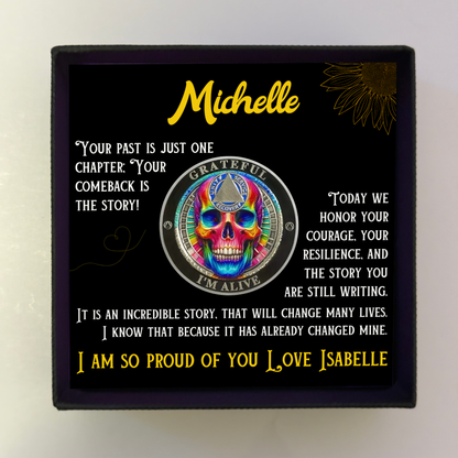 Gift card in square box with “Michelle” name and rainbow skull coin artwork