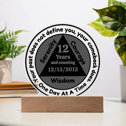 Circular sobriety date plaque with wooden base; reads 12 Years and Wisdom
