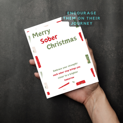 Merry Sober Christmas card held in hand, encouraging message 'Encourage them on their journey'