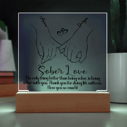 LED sobriety plaque with hands-heart design and message on wood base