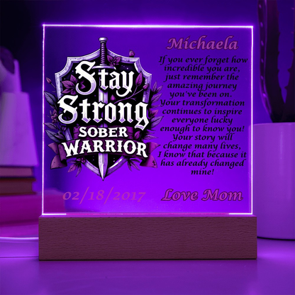Personalized LED plaque with purple glowing border, shield text and name Michaela