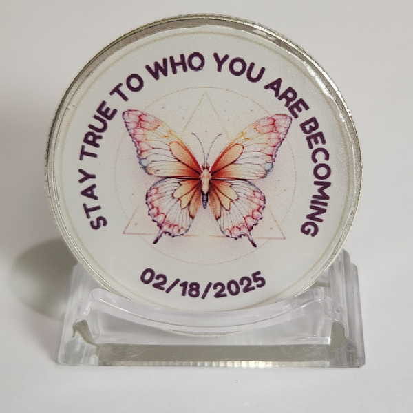 Butterfly recovery coin on clear acrylic stand, purple text and date 02/18/2025.