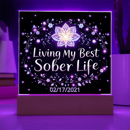 LED acrylic plaque with “Living My Best Sober Life” and lotus floral lights on base