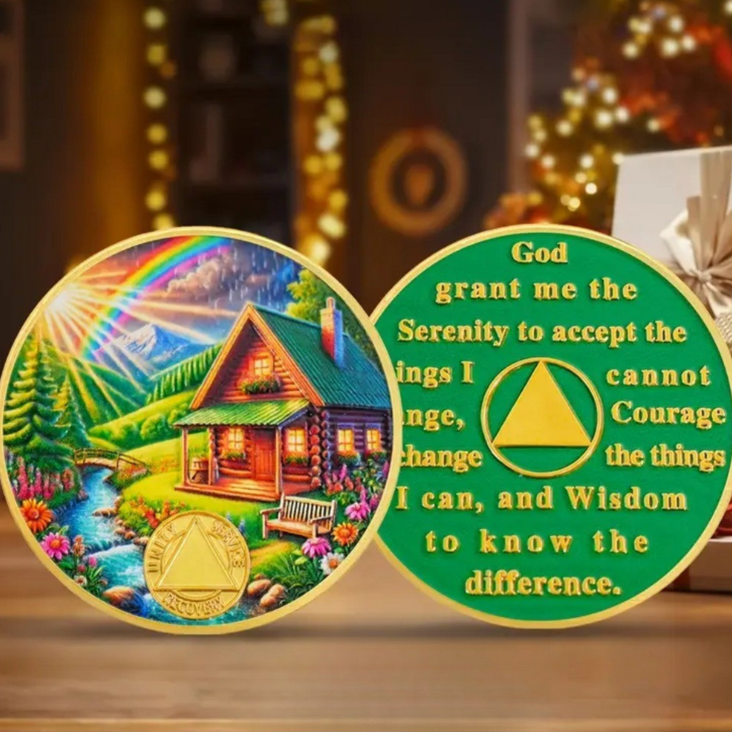 Circular sobriety milestone coins with green text, featuring house landscape and emblem
