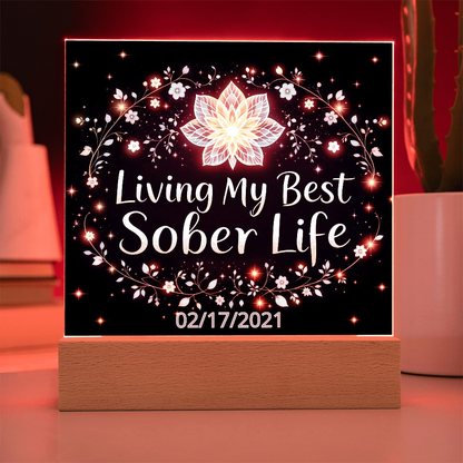 LED acrylic plaque on base with “Living My Best Sober Life” glowing floral lights