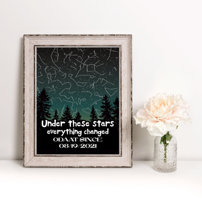 Framed star map wall art with pine silhouettes, constellation lines, and white title text