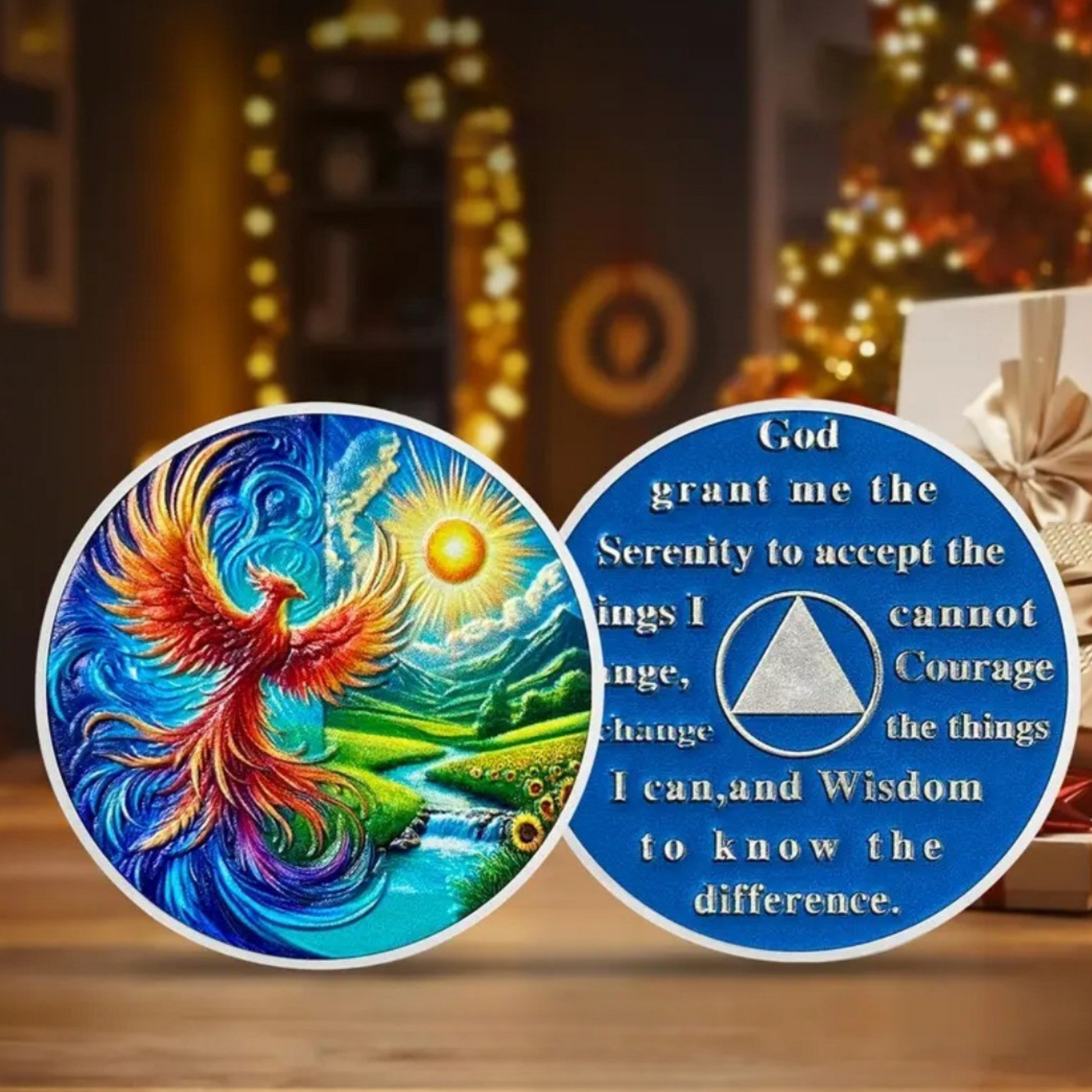 Two round sobriety coins with blue phoenix and faith prayer text