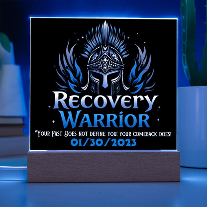 LED acrylic plaque with warrior emblem and “Recovery Warrior” on wood base, blue glow