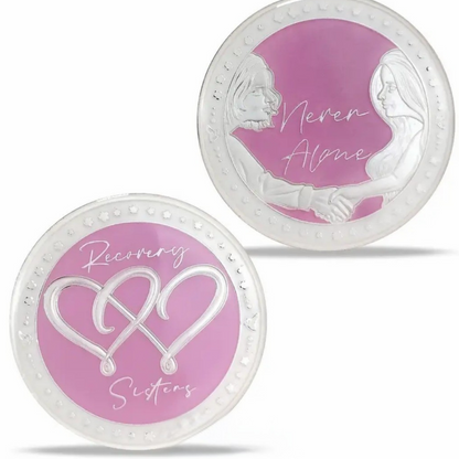 Two silver coins with purple centers, infinity-heart design and “Never Alone” lettering