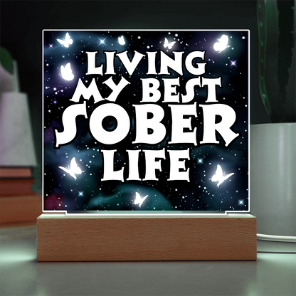 Square LED acrylic plaque on wood base, bright glow of "Living My Best Sober Life".