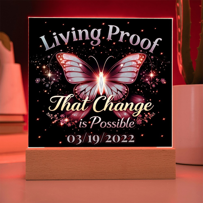 LED acrylic plaque with red butterfly glow and 'Living Proof That Change is Possible 03/19/2022'