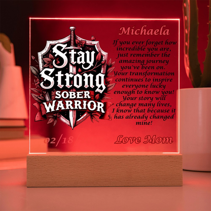 Personalized LED plaque with red glowing border, shield text and name Michaela