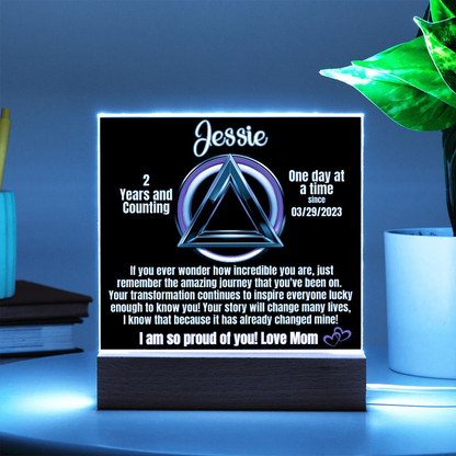 Personalized LED sobriety milestone plaque with blue glow triangle motif on wooden base