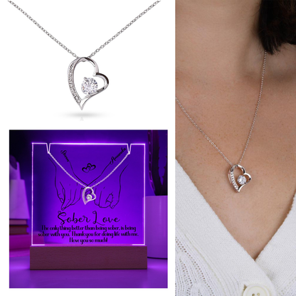 Silver heart pendant necklace with round center stone and curved heart frame