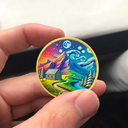 Rainbow cabin side coin with winding river, mountains, trees, and blue globe; gold rim