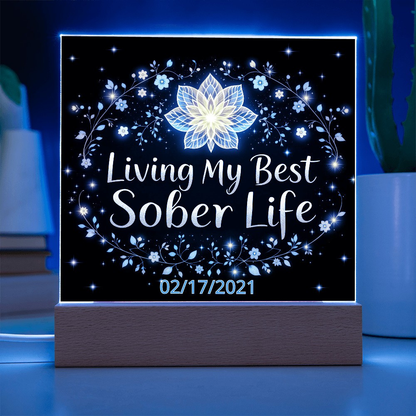 LED acrylic plaque with “Living My Best Sober Life” lotus floral lighted design on base