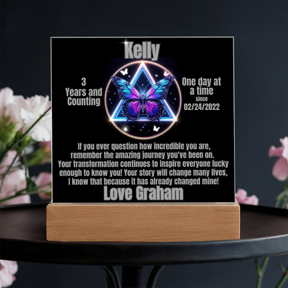 Personalized LED milestone plaque with glowing butterfly emblem and wooden base