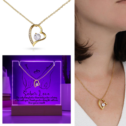 Gold heart pendant necklace with round center stone and pavé heart outline