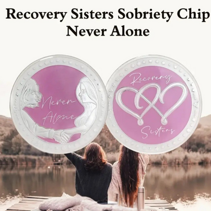 Two silver coins with purple enamel centers and infinity-heart emblem with Recovery Sisters