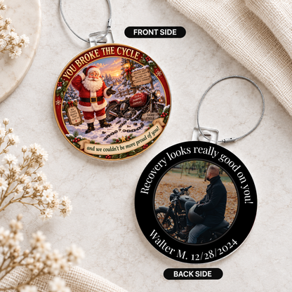 Two round acrylic hanging ornaments on light stone with Santa front and recovery photo back