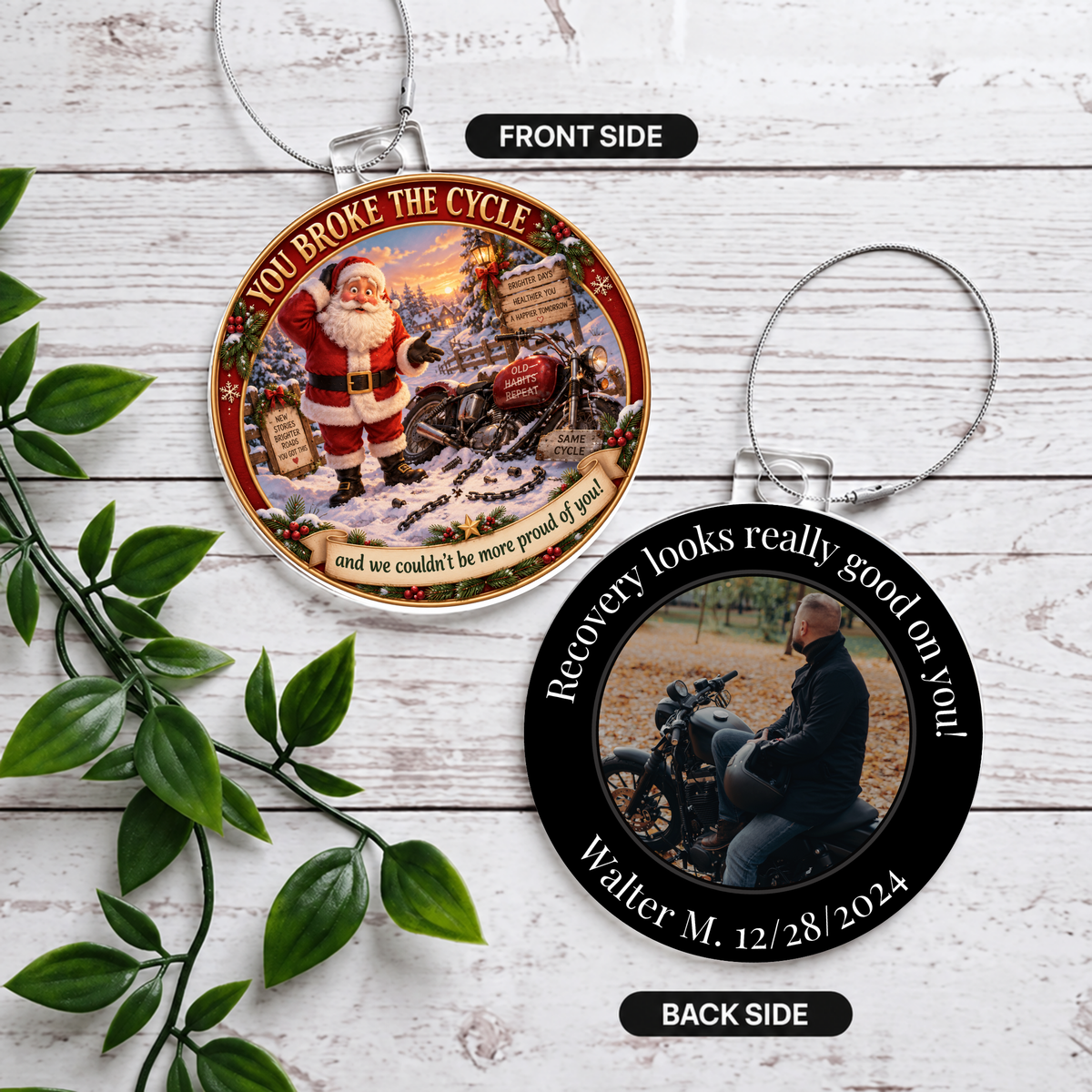 Two round acrylic hanging ornaments, Santa front and recovery photo back, on white wood